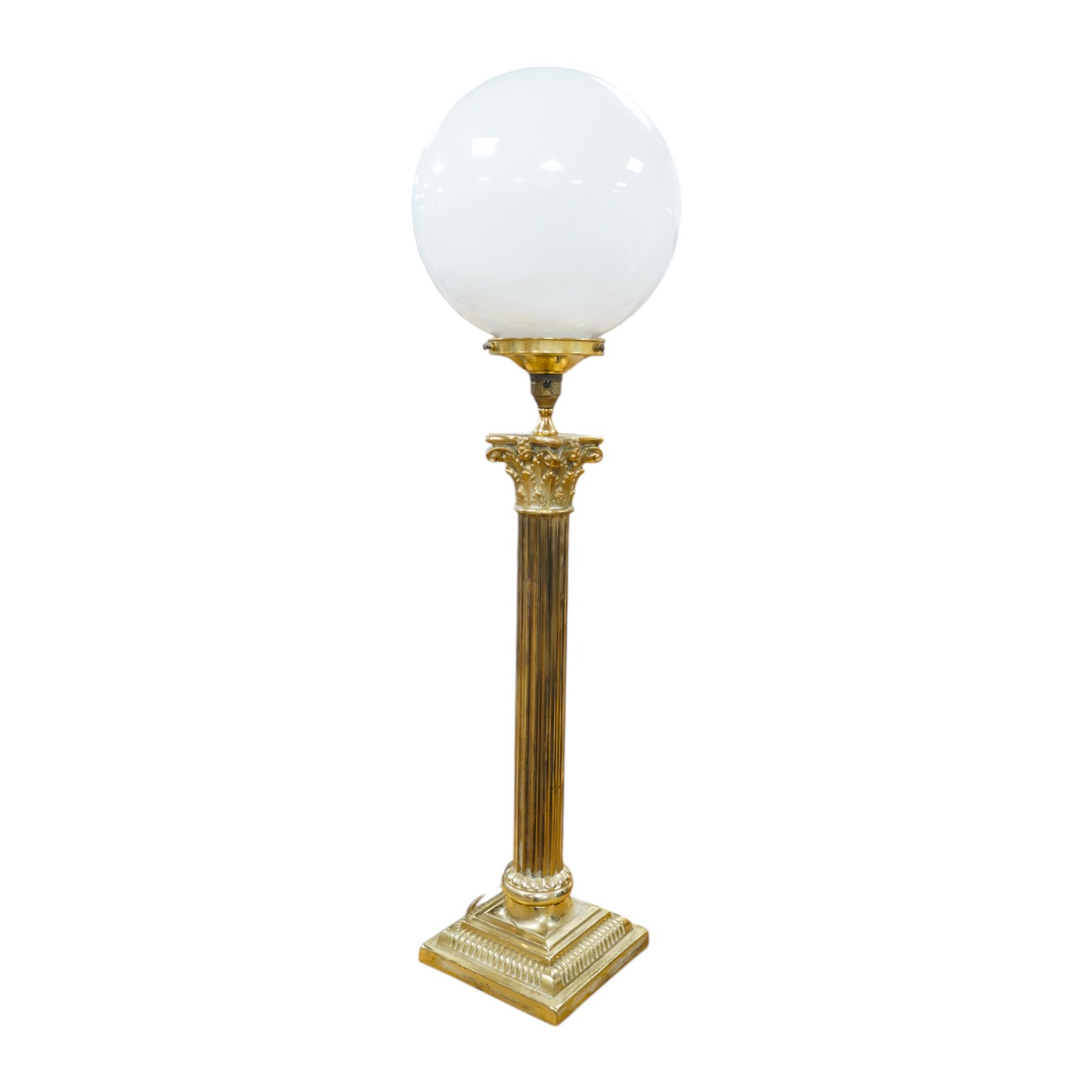 A tall brass Corinthian column table lamp with spherical glass shade, 84cm high including glass shade. Condition - good, brass tarnished at base